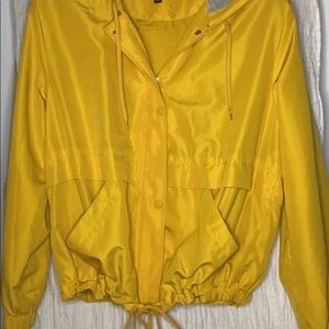 Hooded yellow rain jacket. Only worn once.